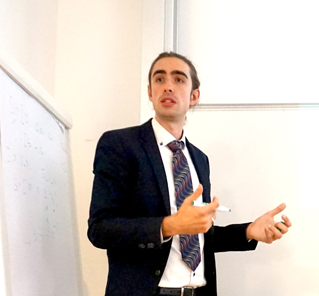 Gotthold Fläschner giving a lecture at a whiteboard